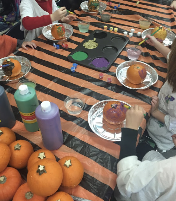 adding pumpkin painting to your art center for your kindergarten halloween party