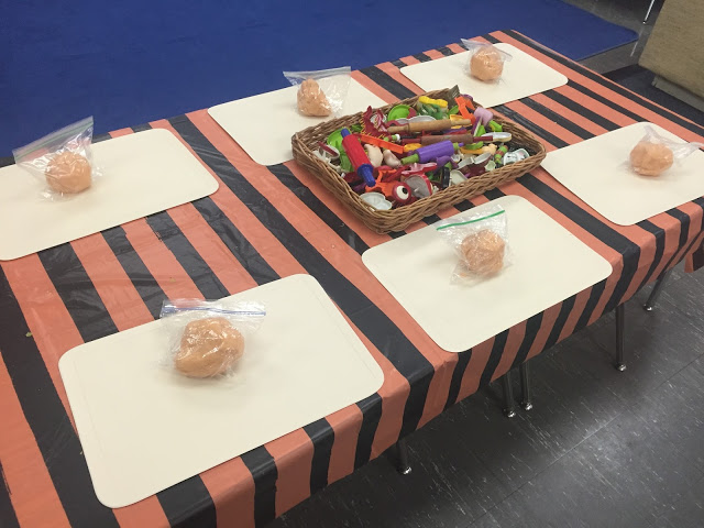 adding pumpkin play dough and pumpkin faces to your dough center for your kindergarten halloween party