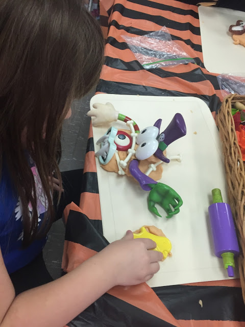 adding pumpkin play dough and pumpkin parts to your play dough center for your kindergarten halloween party