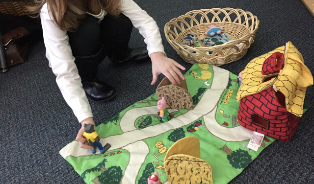 kindergartener retelling story of the three little pigs