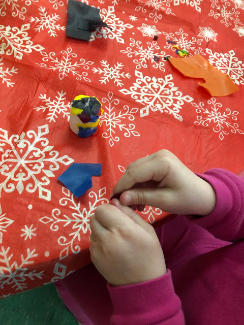 candle decorating at a winter themed station
